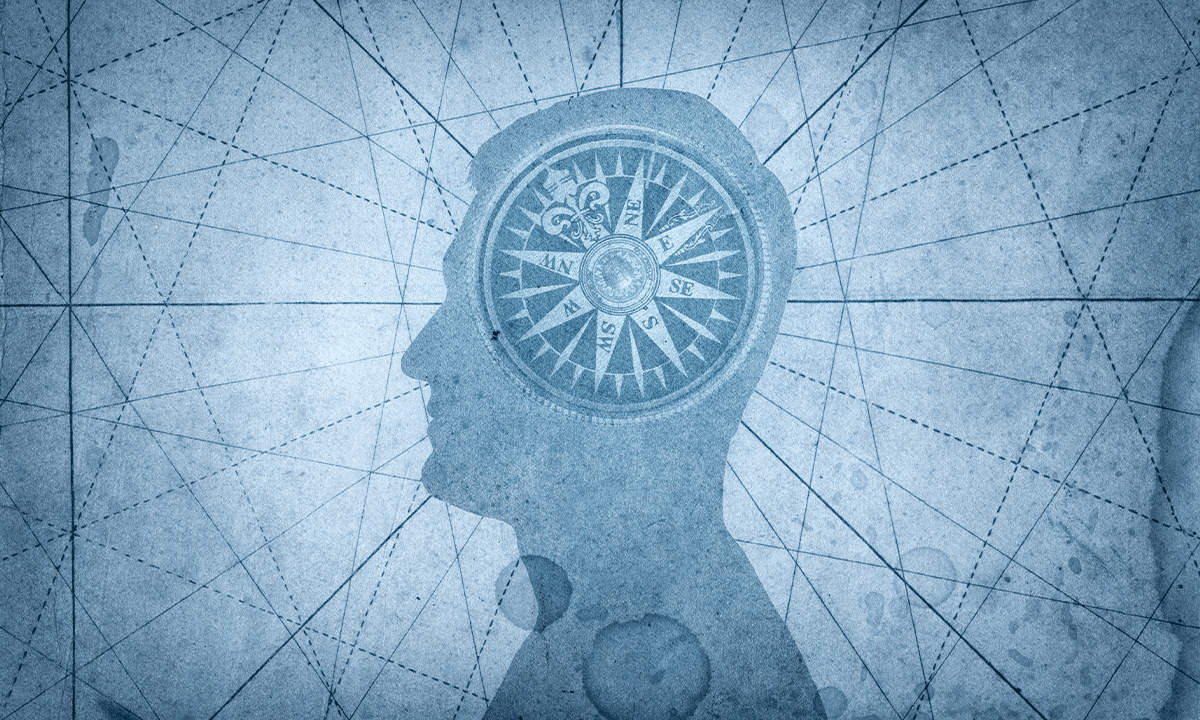 Illustration of a human head sillouhette with a compass inside, on a geometric blue background; concept of morality. Credit: Triff / Shutterstock.