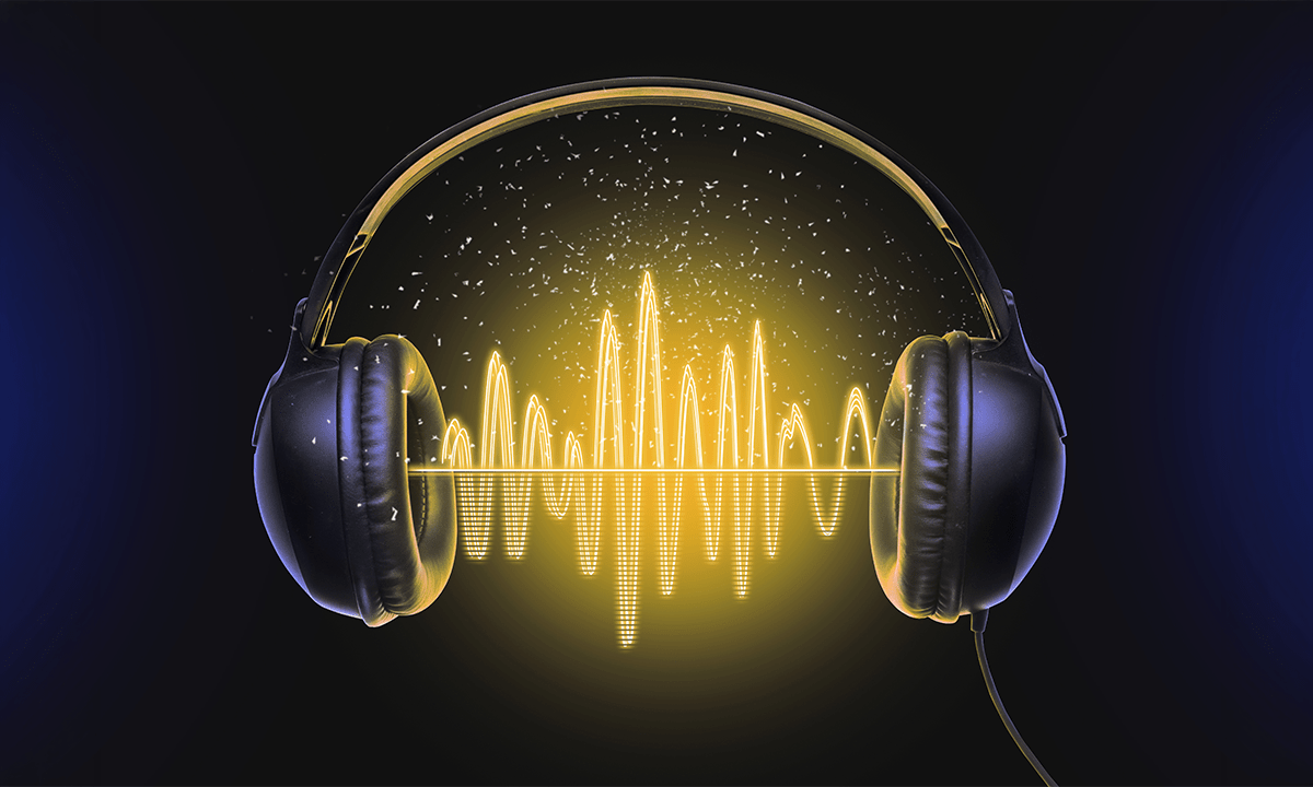 Glowing yellow sound waves inside a pair of black headphones