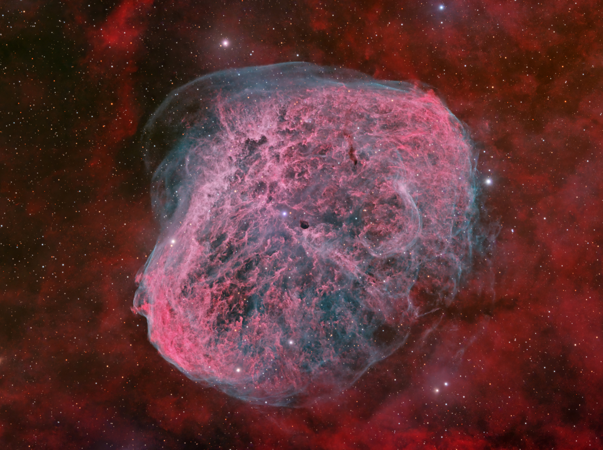The Crescent Nebula: A Gas Bubble Surrounding a Violently Dying