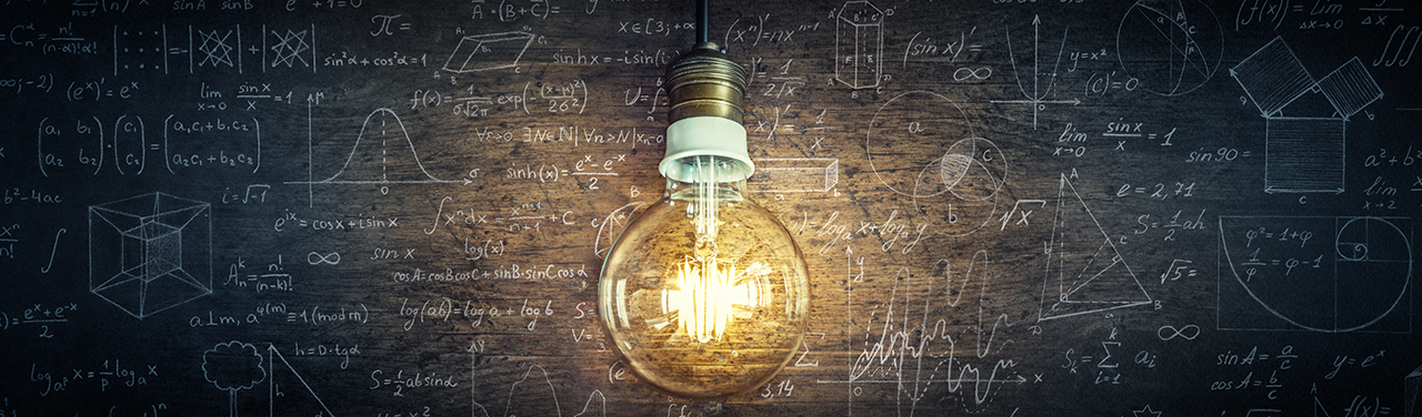 An illustration of a single lightbulb in front of a chalkboard covered in scientific formulas.